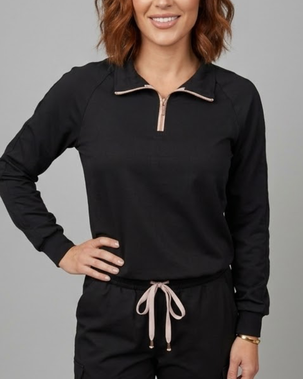 Person wearing a black tracksuit with a gray background